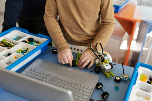 School Students Learning Robotics in Lab