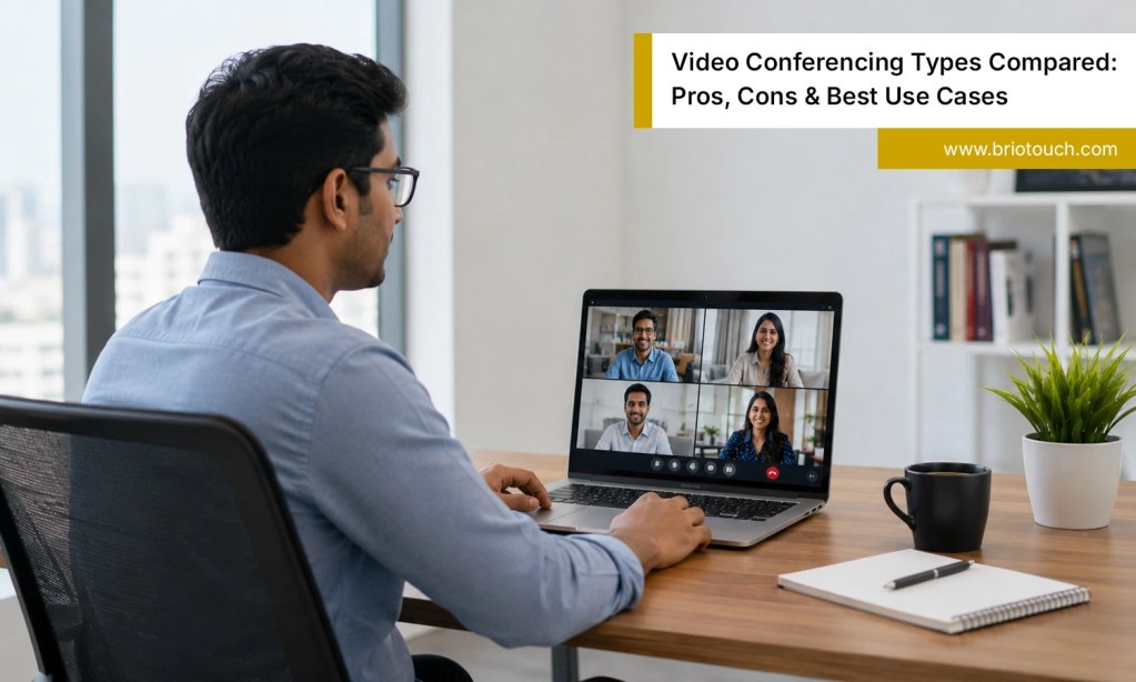 Indian professional using laptop for video conferencing types in a modern workspace meeting online